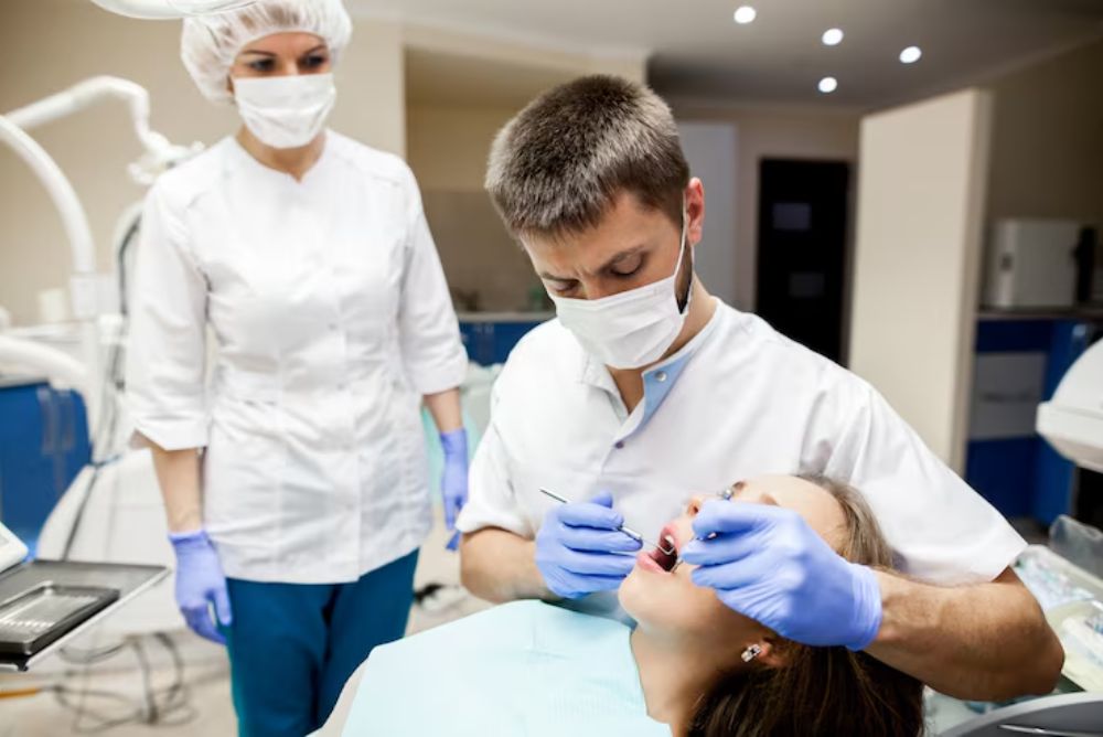 dentist performing a dental bridge procedure to replace a missing tooth