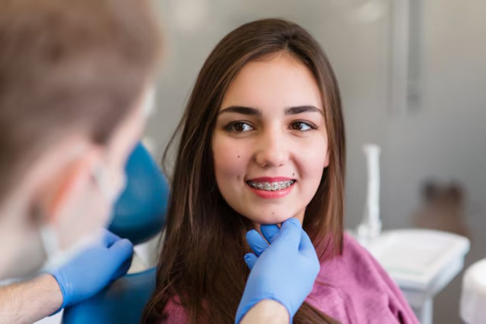female patient discussing braces treatment with a dentist